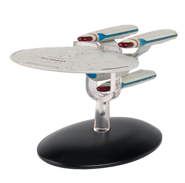 Model of a Star Trek ship on a black base with a white background